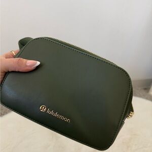 lululemon deep olive green crossbody with gold logo